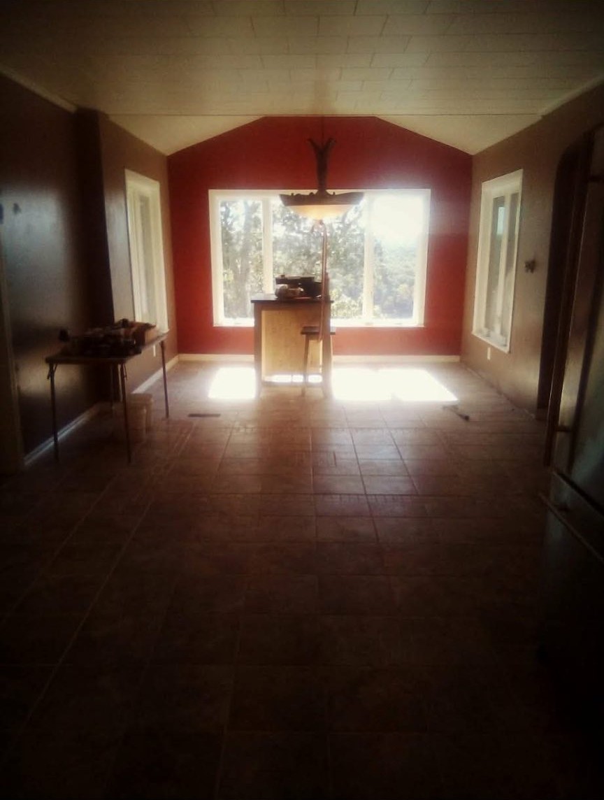 Sunlit dining room addition with new tile flooring