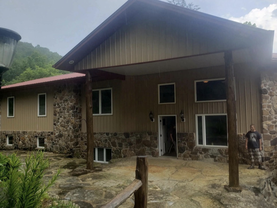 Completed home exterior with stone accents and covered porch