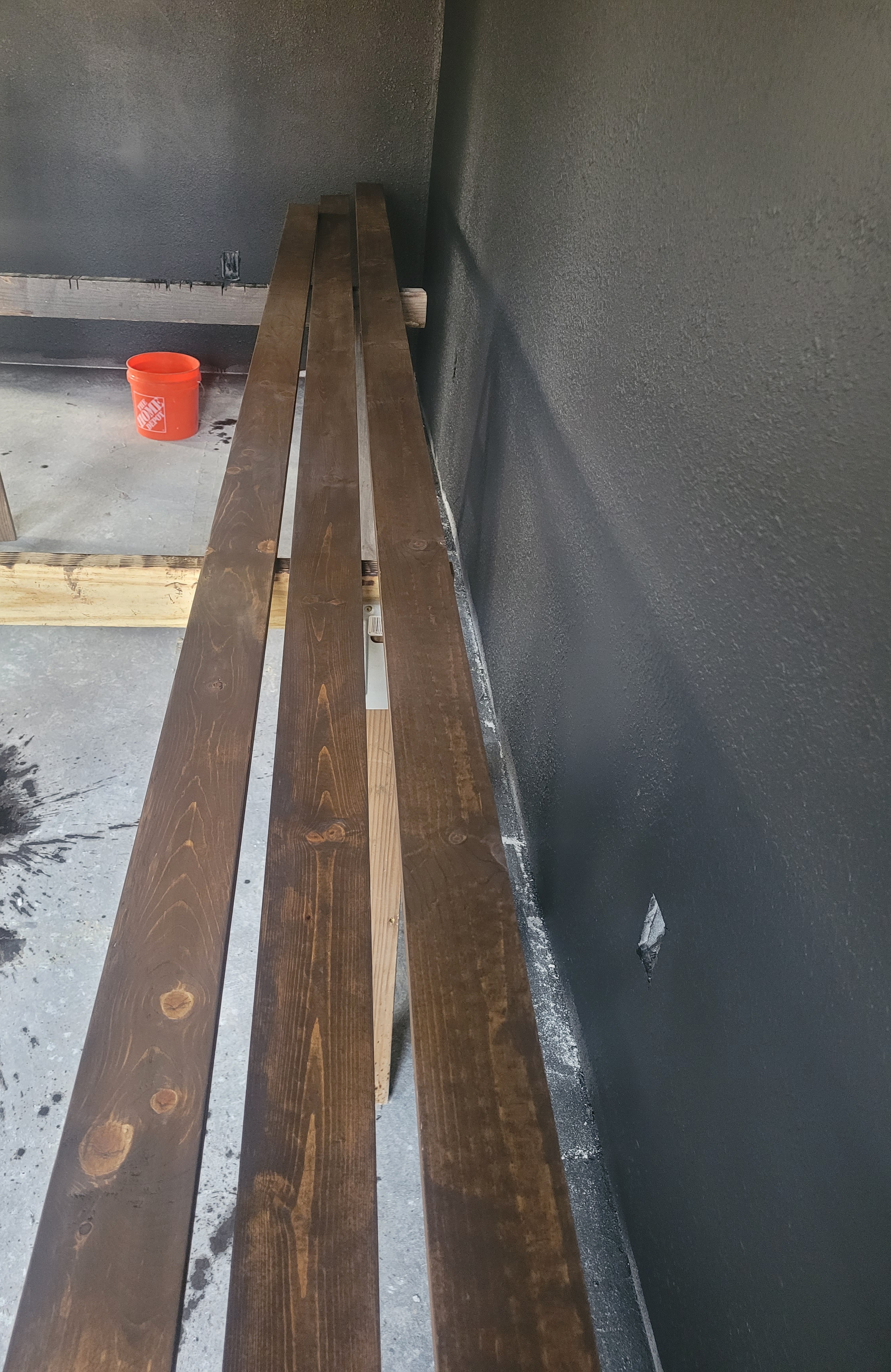 Stained wood slat accent wall in progress